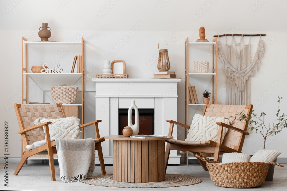 Fototapeta premium Armchairs, coffee table and fireplace in living room