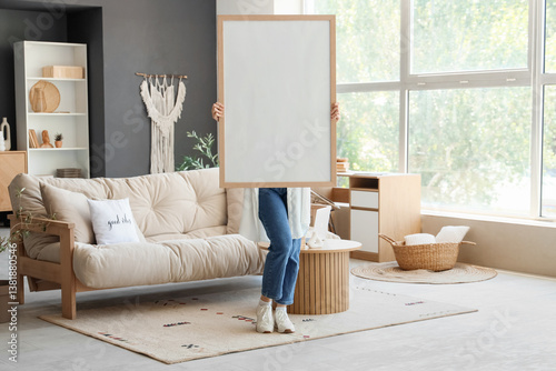 Woman holding blank white f...