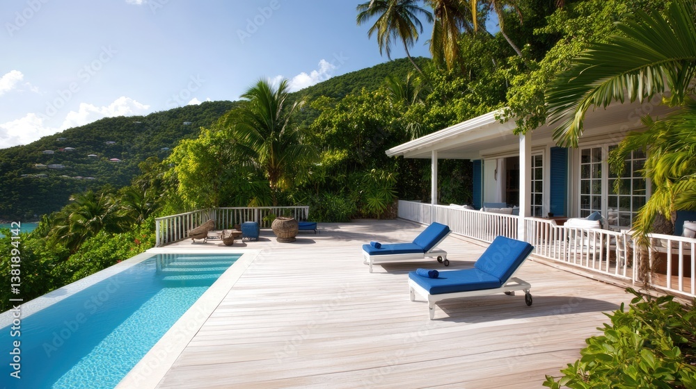 Fototapeta premium A chic seaside villa with a white deck, blue loungers, and surrounding greenery.