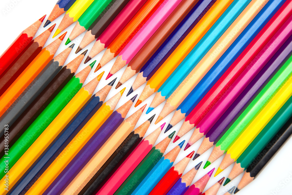 A rainbow of colored pencils stacked in a grid formation on a white background. Perfect for promoting creativity, school essentials, or art-related content.