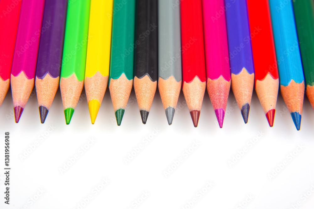 A vibrant collection of colored pencils in a straight line on a white background. Perfect for art education, stationery, or creative inspiration themes. A vibrant collection of colored pencils in a straight line on a white background. Perfect for art education, stationery, or creative inspiration themes.