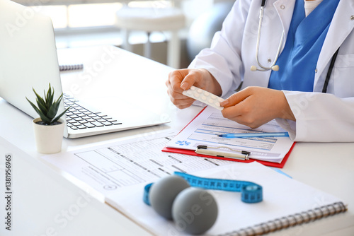 Female doctor with pills at...