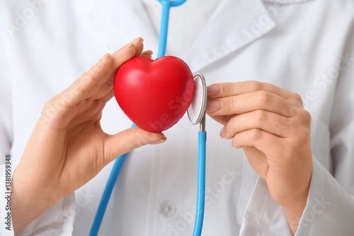 Obraz na płótnie Female doctor with stethoscope and heart, closeup. World Health Day w salonie