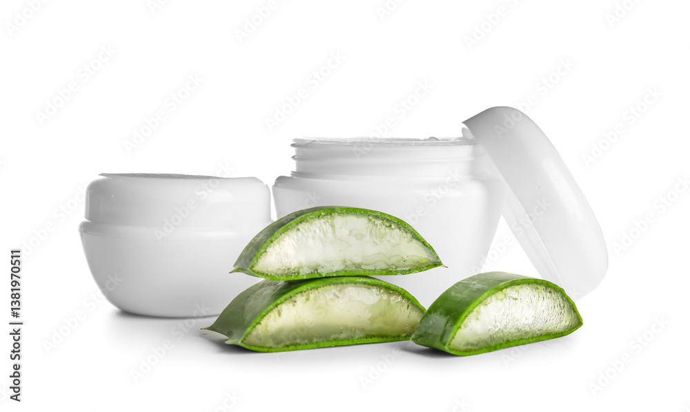 Aloe vera with jars of cream on white background