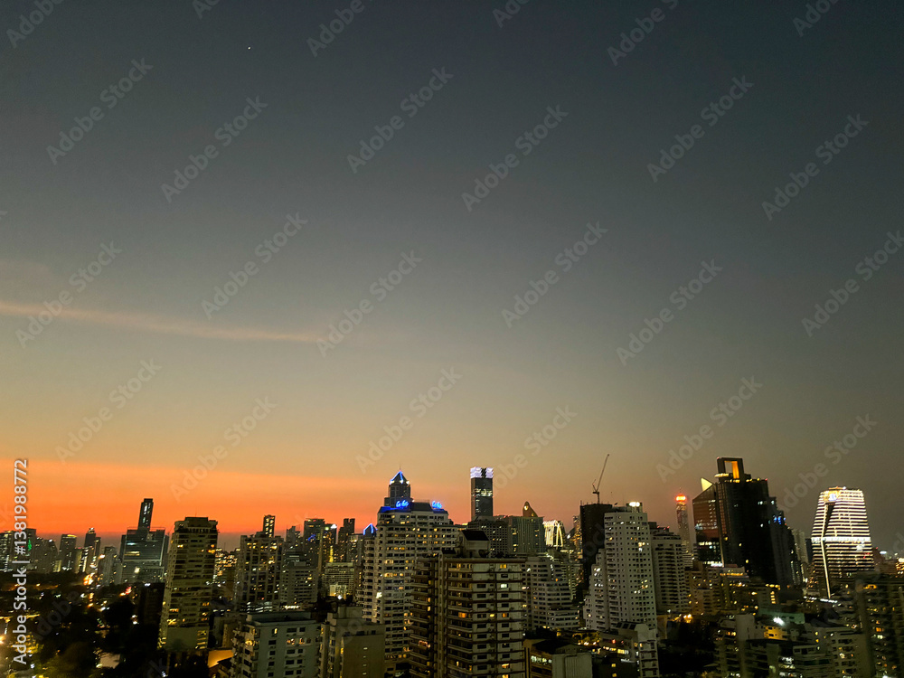 Fototapeta premium Nighttime Skyline of Benchakitti Park and Urban Buildings