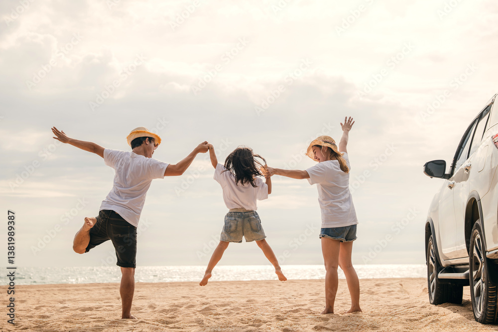 Happy family three hand in hand and jumping on sandy beach, Parents father and mother jump their children back car, holiday vacations summer road trip, Family day enjoying their time together Happy family three hand in hand and jumping on sandy beach, Parents father and mother jump their children back car, holiday vacations summer road trip, Family day enjoying their time together