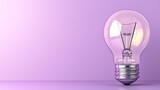 A clear light bulb resting on a purple surface with ample copyspace