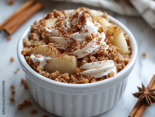 warm pear and ginger crumble with vanilla ice cream and cinnamon,