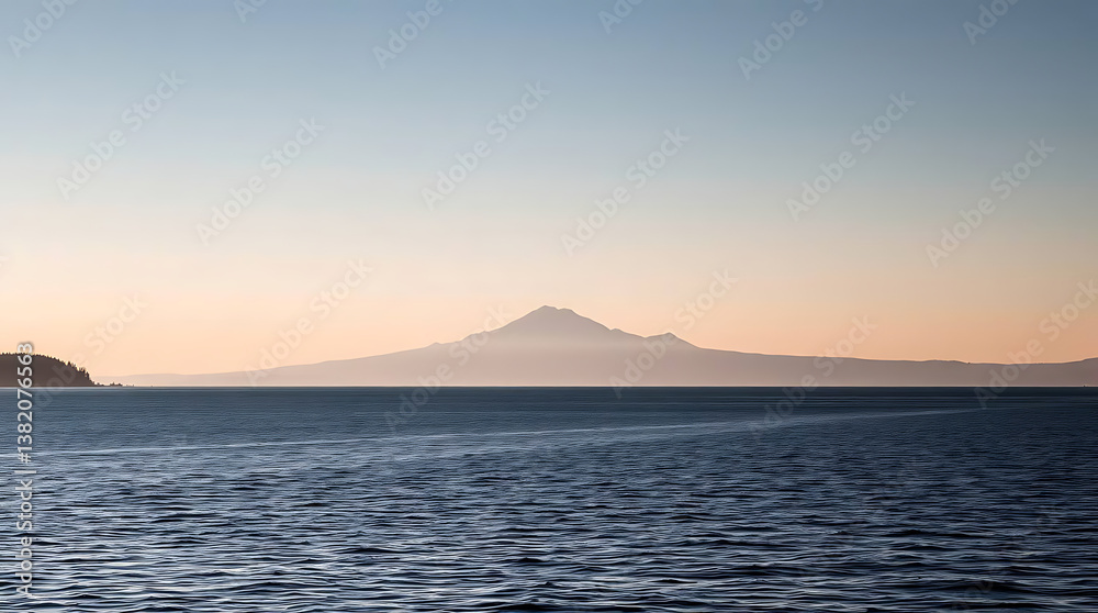 Calm lake sunrise view of distant mountain Calm lake sunrise view of distant mountain