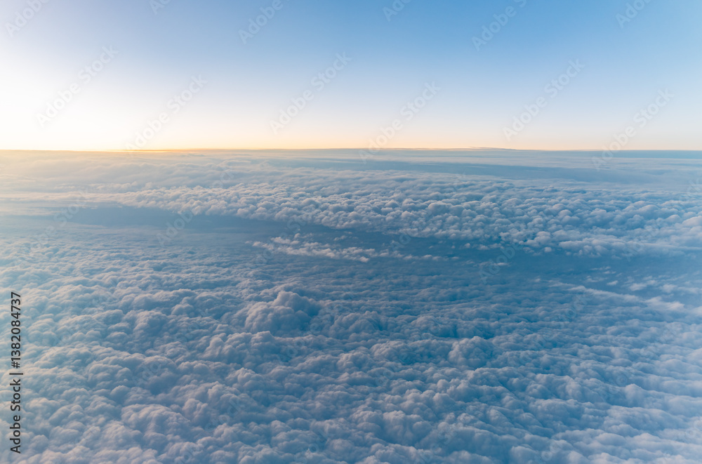 Beautiful orange and pink sunrise over the clouds, view from the plane. Beautiful orange and pink sunrise over the clouds, view from the plane.