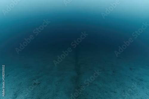 Deep blue underwater scene with sandy ocean floor