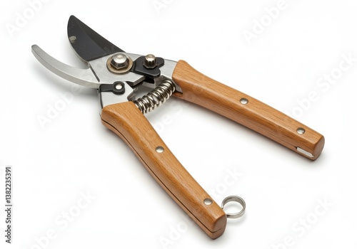 A close up shot of garden shears with wooden handles and metal blades on a white background surface