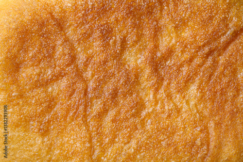 Surface texture of fried baked goods. Close-up of the surface of the pie.