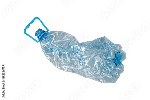 Crushed transparent plastic bottle with a blue handle and cap is isolated. Used PET container prepared for recycling.