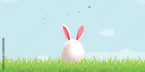 white easter egg bunny in green grass under a blue sky