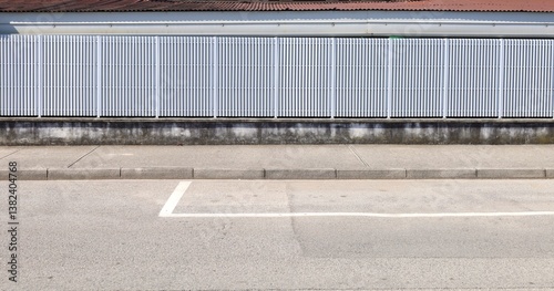 Wallpaper Mural White vinyl privacy fence at the roadside with concrete sidewalk and street in front. background for copy space. Torontodigital.ca