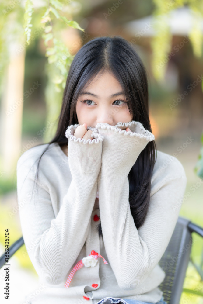 Portrait cute smiles Asian of attractive young teenage girl  the cafe on vacation at a coffee shop in spring day