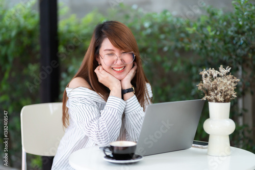 asian freelance people business female talking making using casual working with laptop computer for browsing internet, chatting and blogging and smartphone,notebook in coffee shop.