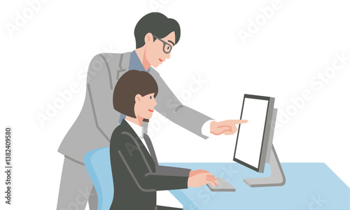 パソコンの前で打ち合わせする男女