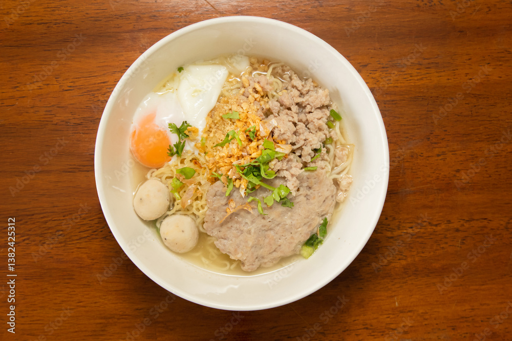 Indoor delight close-up of flavorful noodle soup with asian culinary toppings Indoor delight close-up of flavorful noodle soup with asian culinary toppings
