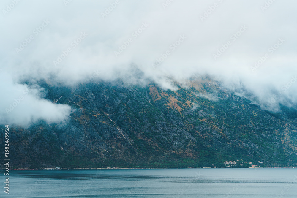 Moody foggy landscape in European fjord bay