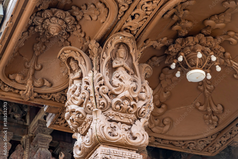 Fototapeta premium The intricate wooden architecture of the Temple of Truth in Pattaya,Thailand.The temple features ornate carving and statues,with a detailed root structure and multiple spires.outside view