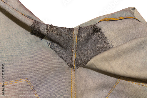 Isolated blue jeans darned from the inside