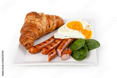 Obraz na płótnie English breakfast with fried egg, sausages and croissant w salonie