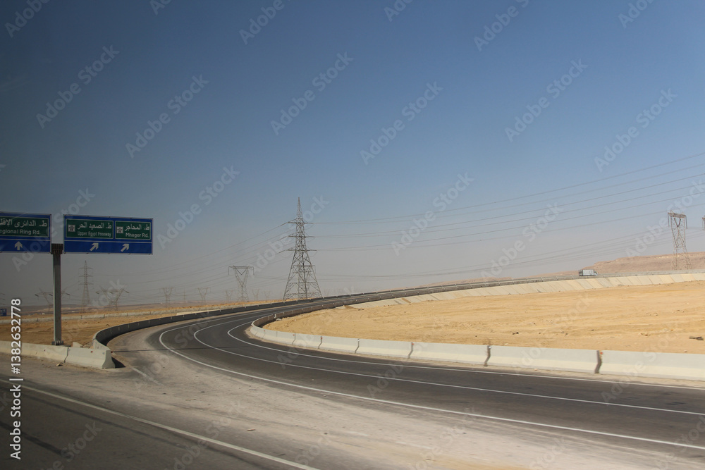 Fototapeta premium Desert scenery with the transmission tower on the road trip from Hurghada to Cairo, Egypt