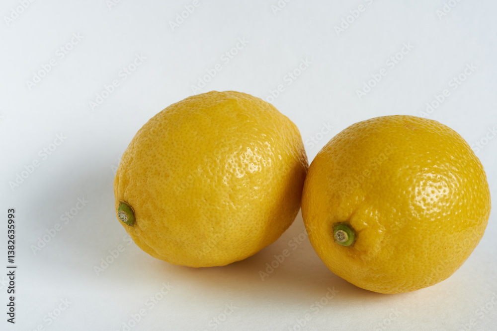 Lemons on a white background. Yellow lemons on a white background. Lemons on a white background. Yellow lemons on a white background.