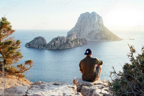 couple sitting on the edge of a cliff