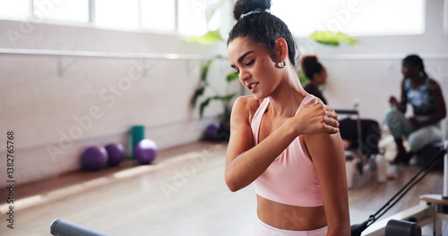 Tableau sur toile Gym, exercise and woman with shoulder pain for fitness, muscle tension and inflammation in studio