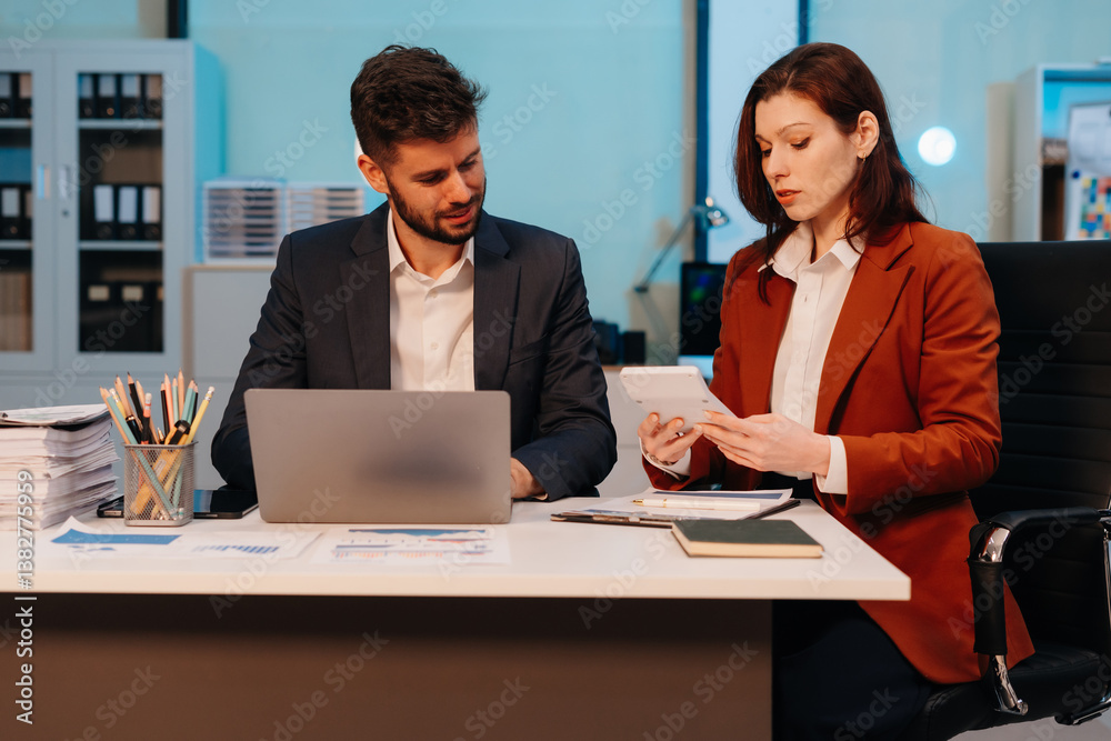 Business team working on a project in the office or reviewing and discussing a business project. Business team working on a project in the office or reviewing and discussing a business project.