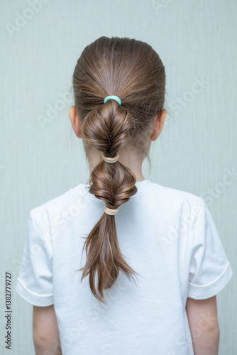 Little girl with Boxer braids, African hair style also known as Kanekalon braids. Close up on hairstyle