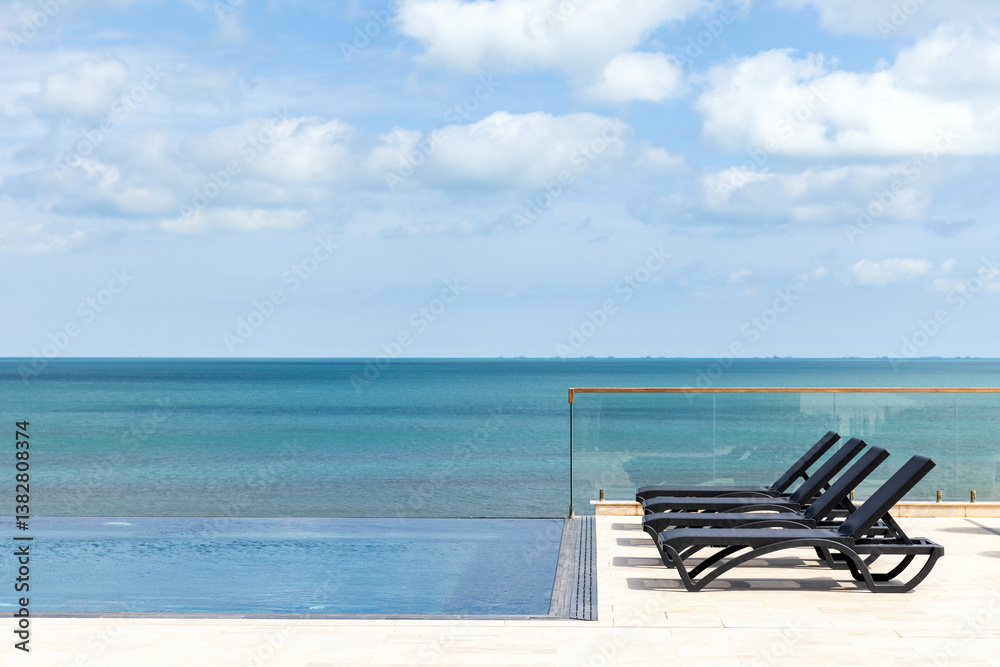 Tranquil view of an infinity pool at the sea coast with a relaxing atmosphere