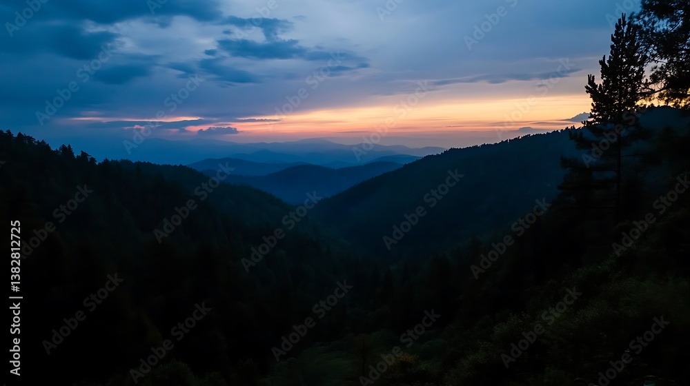 Naklejka premium Majestic Sunset over Misty Mountain Ranges.