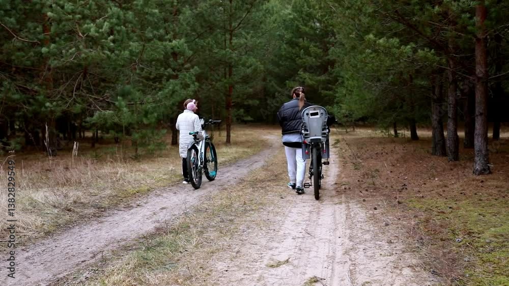 Exploring nature paths on bicycles with friends in a serene forest setting Exploring nature paths on bicycles with friends in a serene forest setting