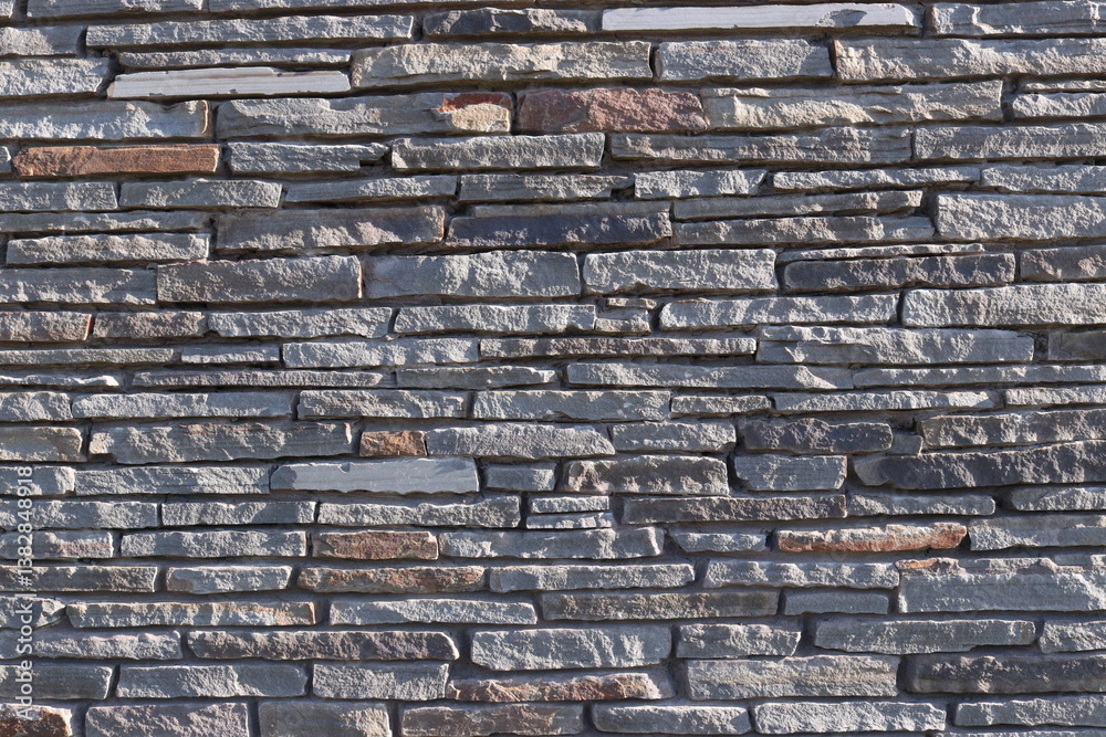 Naklejka premium Stone Slate Walls Brickwork Slim Strip Rectangular Bricks uniform neat texture surface background