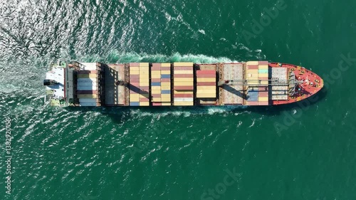 Large container ship at sea. Top down view. Aerial top view of cargo container ship vessel import export container sailing.