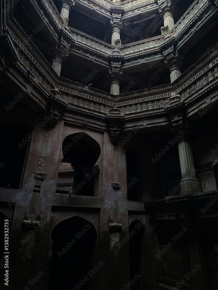 Fototapeta premium Inner view of Adalaj Ni Vav (Stepwell) or Rudabai Stepwell. Built in 1498 by Rana Veer Singh is five stories deep. Ahmedabad, Gujarat, India