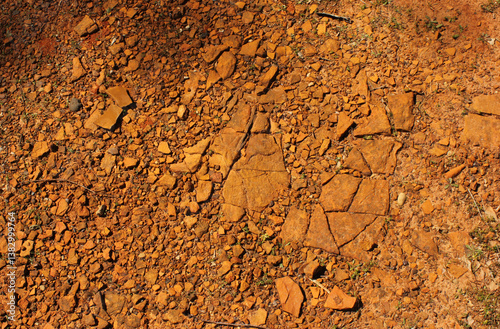 Red Dirt With Rocks and Gravel Background