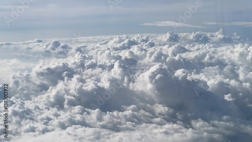 Flying above the clouds. Aerial view of clouds at sunrise. Traveling by air perfect background, 4k