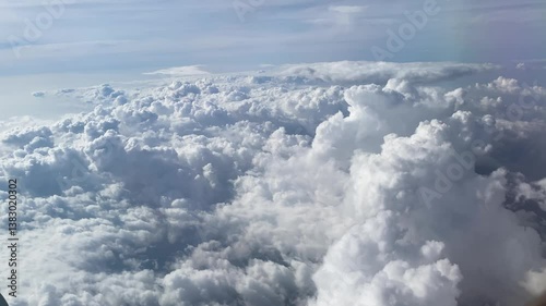 Flying above the clouds. Aerial view of clouds at sunrise. Traveling by air perfect background, 4k