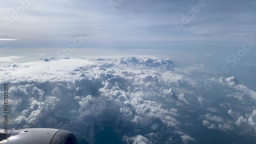Flying above the clouds. Aerial view of clouds at sunrise. Traveling by air perfect background, 4k