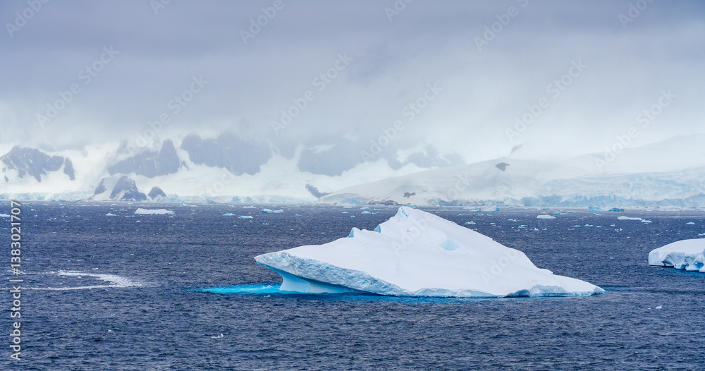 Charlotte Bay as seen from Portal Point, a narrow point on the Reclus Peninsula that served as a gateway to the continental plateau of Antarctica in 1956 when a refuge was established on its coast