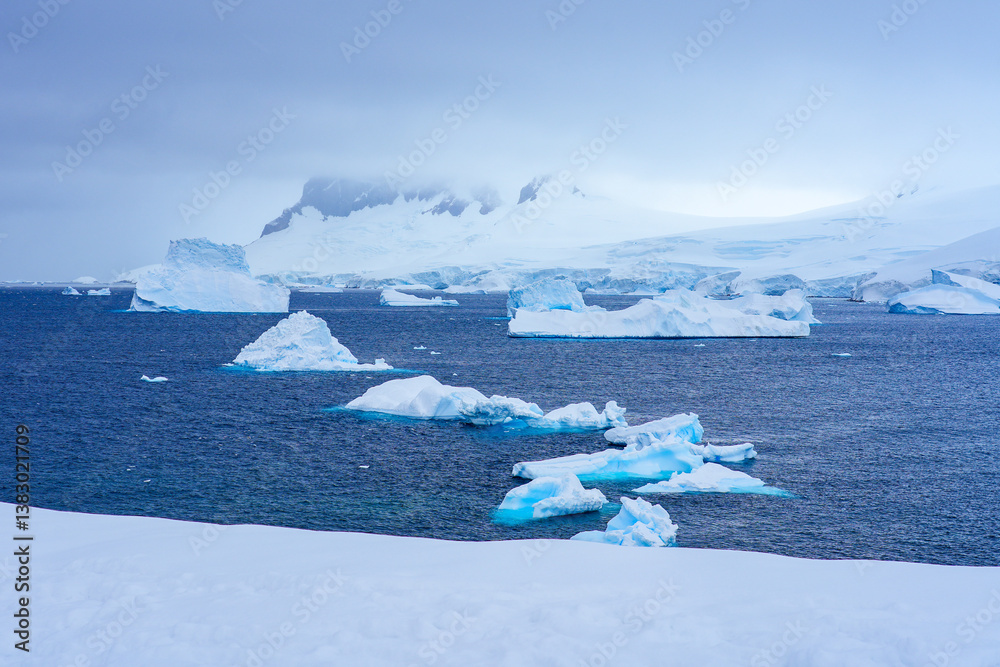 Charlotte Bay as seen from Portal Point, a narrow point on the Reclus Peninsula that served as a gateway to the continental plateau of Antarctica in 1956 when a refuge was established on its coast