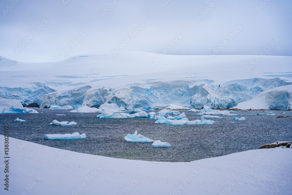 Charlotte Bay as seen from Portal Point, a narrow point on the Reclus Peninsula that served as a gateway to the continental plateau of Antarctica in 1956 when a refuge was established on its coast