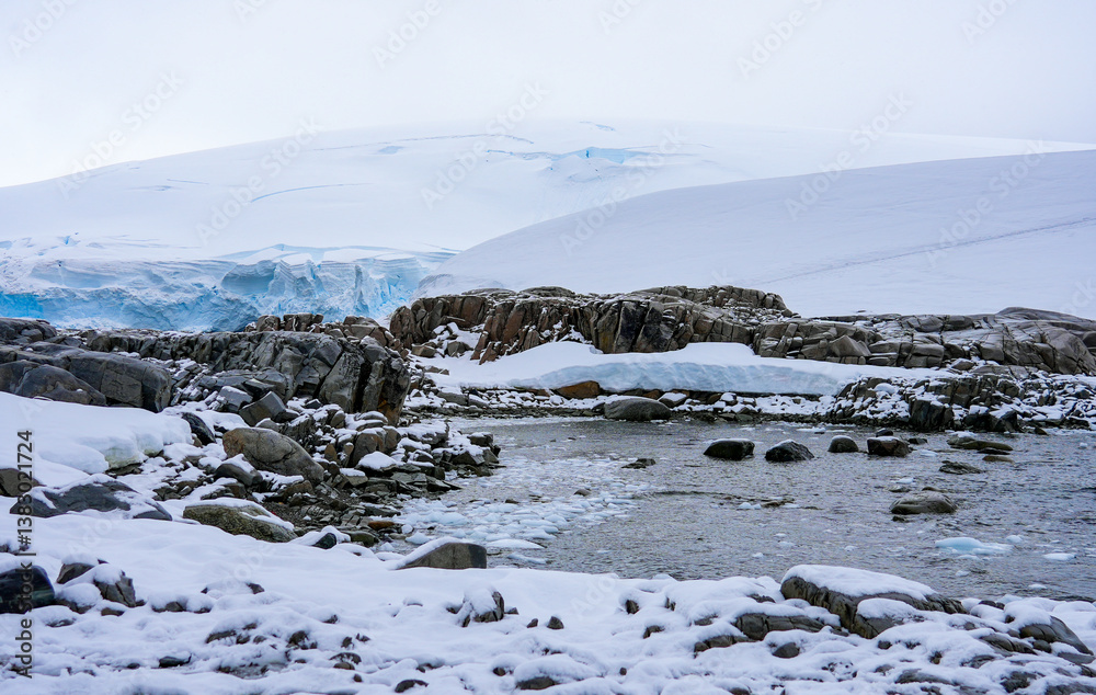 Bay of Portal Point, a narrow point on the Reclus Peninsula that served as a gateway to the continental plateau of Antarctica in 1956 when a refuge was established on its coast