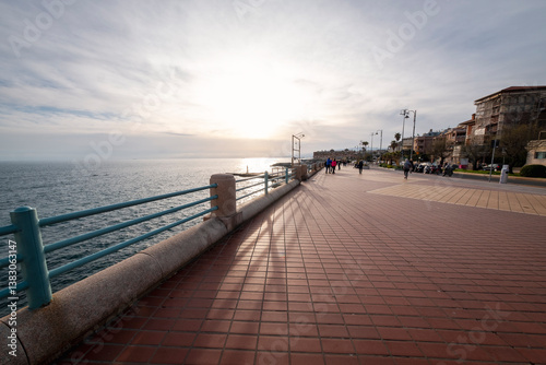 Springtime sunset over the Ligurian sea, taken from one sea promenade at the eastern neighborhoods of the city of genoa (ligurian region, northern italy).