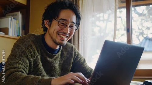Freelancer Editing Videos on Laptop in a Bright Studio Space
